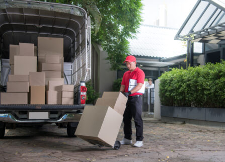 asian-delivery-man-red-uniform-delivering-parcel-boxes-woman-recipient-home Asian delivery man in red uniform delivering parcel boxes to woman recipient at home