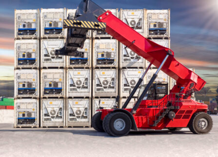 Reachstacker standby for pick up the reefer container at container yard. Reachstacker standby for pick up the reefer container at container yard.