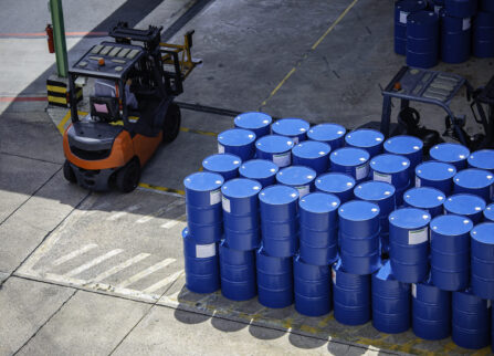 Top view oil barrels forklift truck move for on the transportati Top view oil barrels forklift truck move for on the transportation worker help arrange.